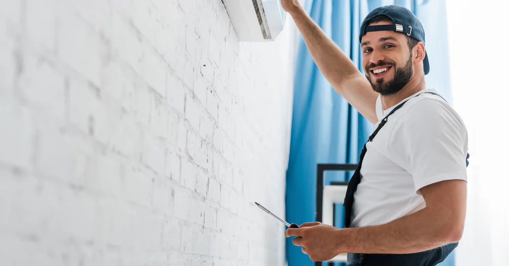 Man cleaning AC